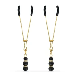 Pinces à mamelons dorées avec des perles noires
